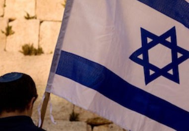 man-helped-by-Jewish-Federation-holds-Israeli-flag