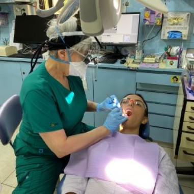 Dentist examining someone's teeth in Israel