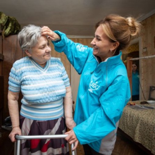 Older woman being helpedby younger woman