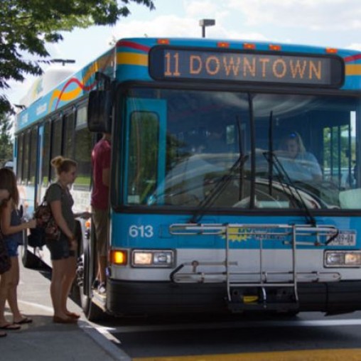 People getting on the TCAT bus