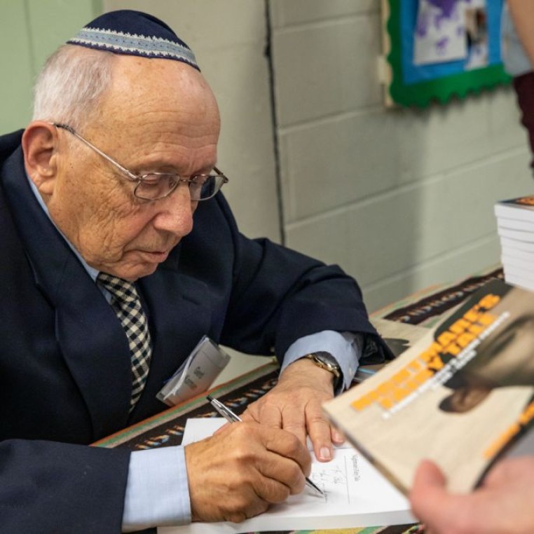 Gerd Korman signing books