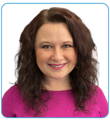 Brightly smiling, facing forward in a portrait.