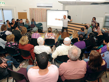 Group of people at a lecture- Academy in Town Square in Israel 