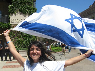 cija advocacy - young woman holding israeli flag 