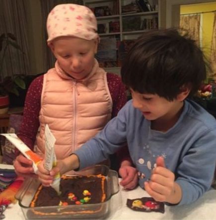 Children making brownies for Hanukkah null