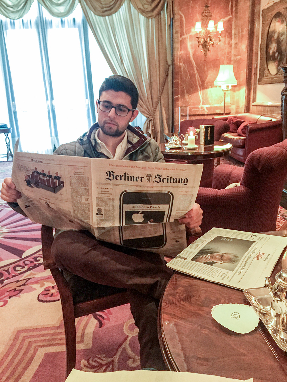 Elan reading a German newspaper