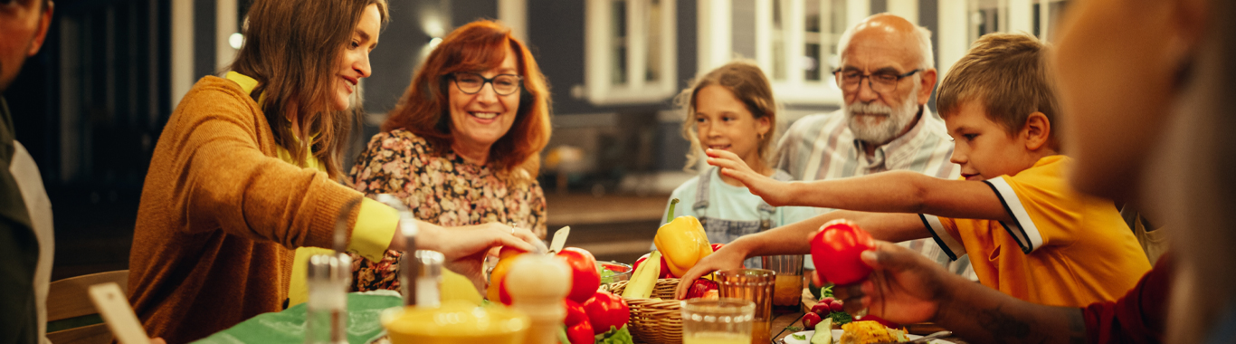 A family sitting around a table for a meal