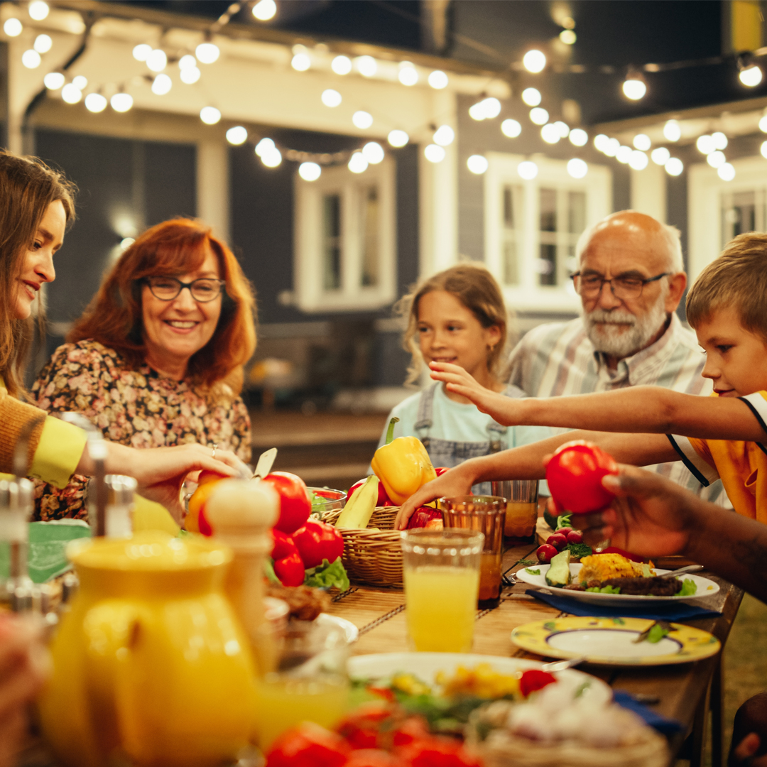 A family sitting around a table for a meal
