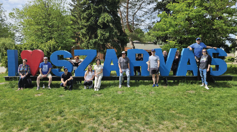 People standing in front of I <3 Szarvas