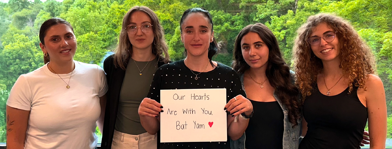 Jewish Women holding a sign sharing love with Bat Yam