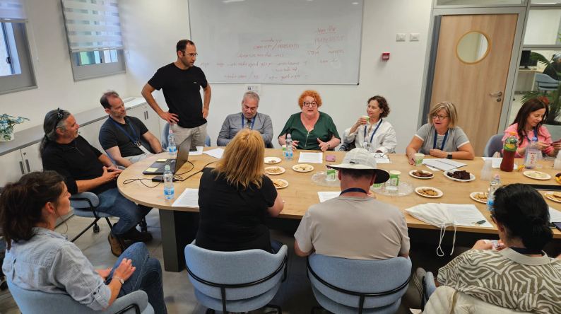 People sitting around a long table