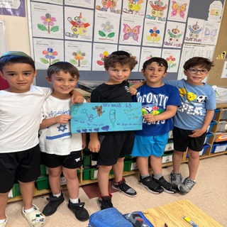 Child/children holding signs of supprt