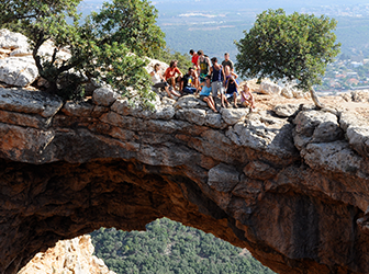 Teens posing on a cliff