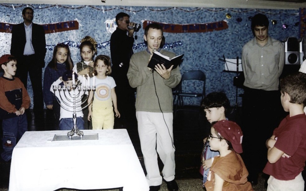 Men, women and children celebrate Hanukkah in Cuba in December 2000. 